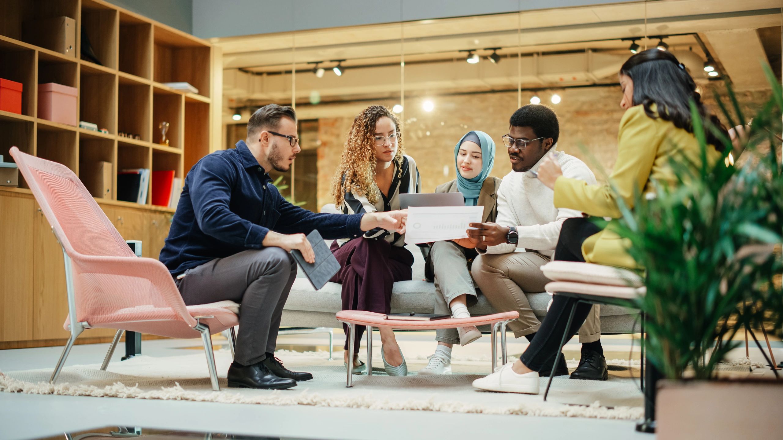 Young professionals collaborating during a leadership presentation
